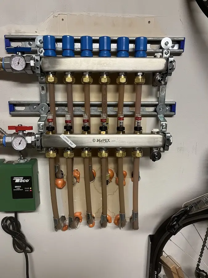 Plumber performing Water Heater Repair at a residential property in Clinton